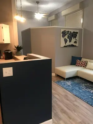 a living room with a couch and a table at Renovated Downtown Condo in the HEART OF IT ALL in Cleveland
