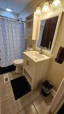 a bathroom with a sink and a toilet and a mirror at 3 BDR - Your Perfect Getaway! in Warren