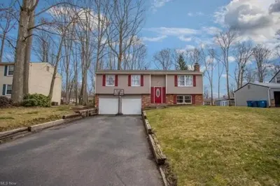 a house with a red door and a driveway at 3 BDR - Your Perfect Getaway! in Warren