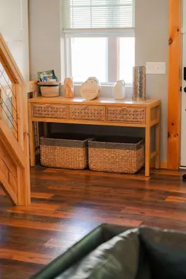 a room with a table with baskets and a window at The Treetop A Hocking Hills Villa Treat in Logan