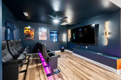a cinema room with chairs and a flat screen tv at 4BR, Home Theater, near Spooky Nook Sports Complex in Hamilton