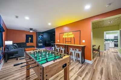 a living room with a foos ball on a table at 4BR, Home Theater, near Spooky Nook Sports Complex in Hamilton