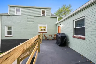 a patio in front of a green house at 4BR, Home Theater, near Spooky Nook Sports Complex in Hamilton