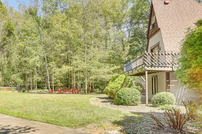 an exterior view of a house with a yard at Walk to School House Winery Home with Deck! in Dover