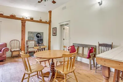 a dining room with a table and chairs at Romantic Pondside Escape Country Cottage in Paris in Paris