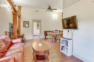 a living room with a couch and a table at Romantic Pondside Escape Country Cottage in Paris in Paris