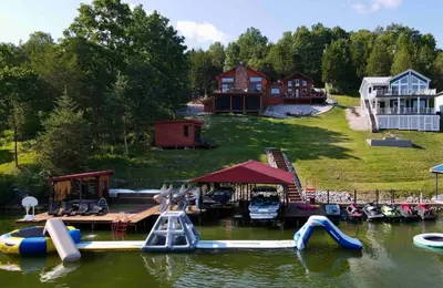 a group of slides in the water on a lake at Lake Therapy at The ARK | Gameroom, Hot Tub, Dock in Williamstown