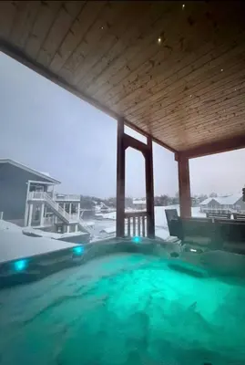 a large swimming pool in a house in the snow at Lake Therapy at The ARK | Gameroom, Hot Tub, Dock in Williamstown
