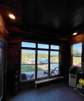 a room with a large window with a view of the water at Lake Therapy at The ARK | Gameroom, Hot Tub, Dock in Williamstown