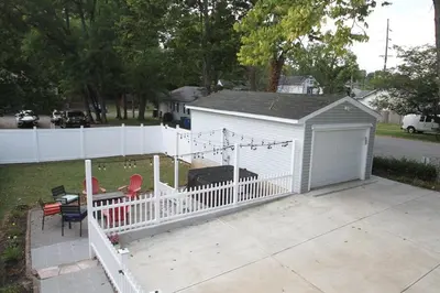 a white building with a fence and a grill at 1880s Georgetown Jewel in Georgetown