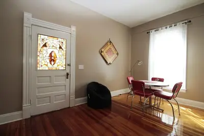 a dining room with a table and a stained glass window at 1880s Georgetown Jewel in Georgetown