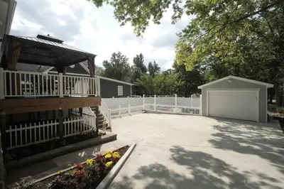 a backyard with a white fence and a white garage at 1880s Georgetown Jewel in Georgetown