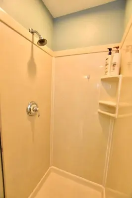 a shower with a glass door in a bathroom at Large 4 bedroom Tremont House - Bonus apartment included! in Cleveland