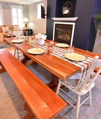 a dining room table with chairs and a fireplace at Large 4 bedroom Tremont House - Bonus apartment included! in Cleveland