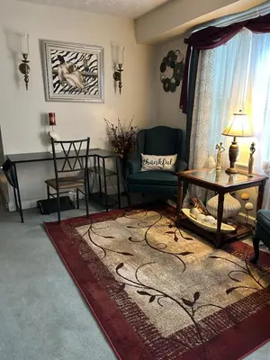 a living room with a couch and a table at Suite Serenity in Cleveland