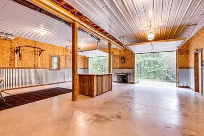an empty room with a table in the middle at Hot Tub Haven 10 Mi to Hocking Hills State Park! in Amanda