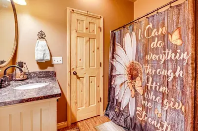 a bathroom with a shower curtain that says canada be beginning therapy at Hot Tub Haven 10 Mi to Hocking Hills State Park! in Amanda