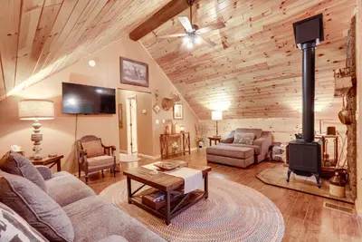 a living room with a wood burning stove in it at Hot Tub Haven 10 Mi to Hocking Hills State Park! in Amanda