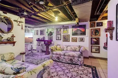 a living room with a couch and a table at The Boulevard Stay in Cleveland
