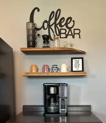 a coffee bar with a coffee maker on a shelf at 5BR/3BA*Game Room*FirePit*Theater*3 mins to ARK! in Williamstown