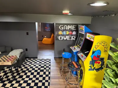a kids room with a video game console and a game counter at 5BR/3BA*Game Room*FirePit*Theater*3 mins to ARK! in Williamstown
