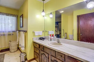 a bathroom with a sink and a large mirror at Fish, Unplug and Unwind! Countryside Plymouth Home