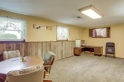 a room with a table and chairs and a desk at Fish, Unplug and Unwind! Countryside Plymouth Home