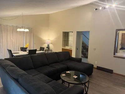 a living room with a couch and a table at Great Price, Great Location in Canton