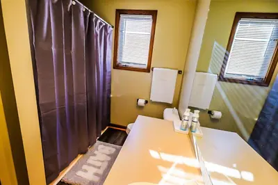 a bathroom with a sink and a toilet and a shower at Great Price, Great Location in Canton