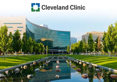 a large building with a pond in front of it at RocknRoll Crib 8 Min Cle Clinic Near Downtown in Cleveland