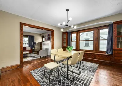 a dining room with a table and chairs at RocknRoll Crib 8 Min Cle Clinic Near Downtown in Cleveland