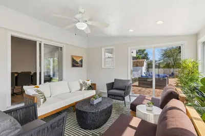 a living room with a couch and a ceiling fan at Ultimate Group Escape Heated Pool - 12 Guests in Parma