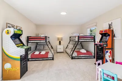 a room with four bunk beds and a video game at Ultimate Group Escape Heated Pool - 12 Guests in Parma