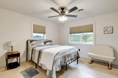 a bedroom with a bed and a ceiling fan at 10 Mi to Red River Gorge Peaceful Rural Getaway! in Campton