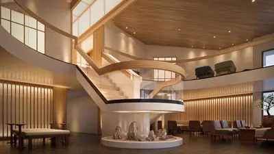 a spiral staircase in a lobby with tables and chairs at The Amaya - 21 and older only in Fort Wayne