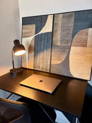 a laptop computer sitting on a desk with a lamp at Spacious Loft with Fireplace - near CSU, Playhouse, Progressive field, R&R Hall of Fame with Gym & Sauna and Sleeps 12 in Cleveland
