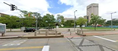 an empty street with a traffic light in a city at Spacious Loft with Fireplace - near CSU, Playhouse, Progressive field, R&R Hall of Fame with Gym & Sauna and Sleeps 12 in Cleveland