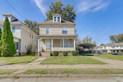 a white house with a window and a driveway at 1 Mi to Dtwn and Franciscan University Home with Yard in Steubenville
