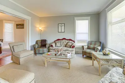 a living room with a couch and chairs and a table at 1 Mi to Dtwn and Franciscan University Home with Yard in Steubenville