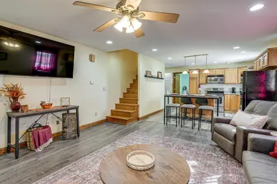 a living room with a couch and a table at 1 Mi to Main St! Family Farmhouse in West Unity