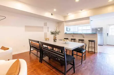 a kitchen and dining room with a table and chairs at Movie Theater-Game Room-Parking-Heart Of Cleveland in Cleveland