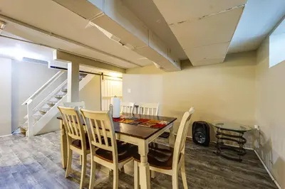 a dining room with a table and chairs at Walk to University of Cincinnati Historic Home! in Cincinnati