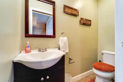 a bathroom with a sink and a toilet at Walk to University of Cincinnati Historic Home! in Cincinnati