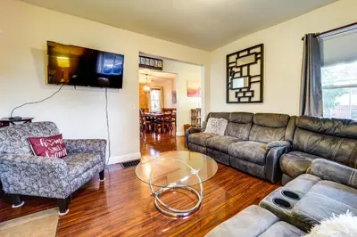 a living room with a couch and a glass table at Walk to University of Cincinnati Historic Home! in Cincinnati