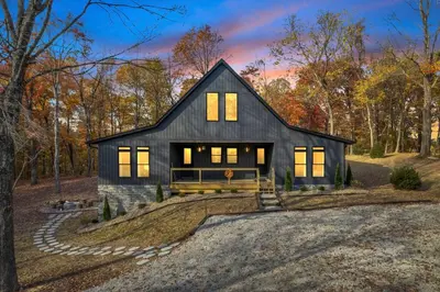 a black house on a hill in the woods at Luxury Cabin in Hocking Hills The Buffalo in Logan