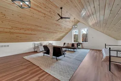 a living room with a wooden ceiling and furniture at Luxury Cabin in Hocking Hills The Buffalo in Logan