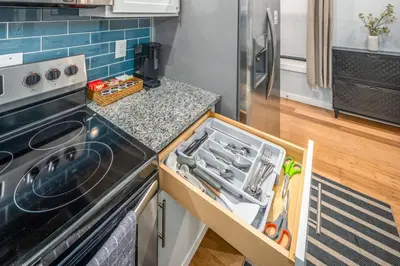 a kitchen with a sink and a stove top oven at Prime OTR by TQL, Smart TVs, King Bed, Wifi, Sleeps 3ppl, 1st Fl in Cincinnati