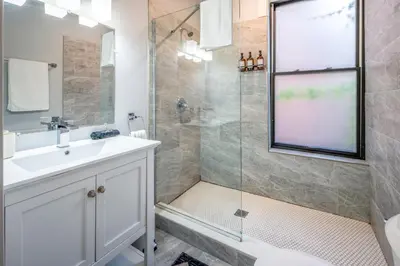 a bathroom with a sink and a shower at OTR by TQL, Smart TVs, Lux King Bed, Fast Wifi, Sleeps 3ppl, 2nd Fl in Cincinnati