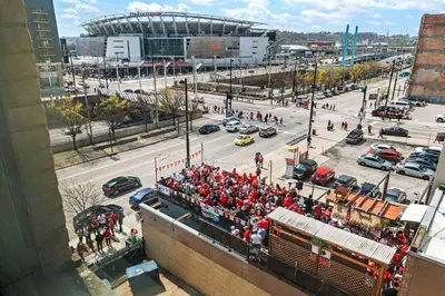 a crowd of people watching a football game at CBD Apartment Pool 24-7 Gym Parking in Cincinnati