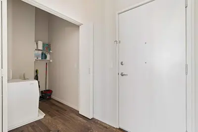 a white closet with a door in a room at CBD Apartment Pool 24-7 Gym Parking in Cincinnati